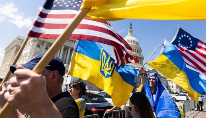Supporters Of Ukraine Wave US And Ukrainian Flags Outside The US Capitol After The House Approved Foreign Aid Packages To Ukraine. Photo: Collected  