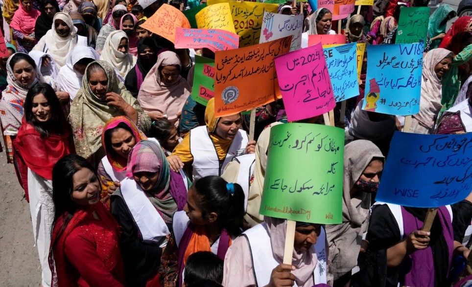 Workers take part in a rally marking International Labour Day in Lahore, Pakistan. Participants demanded.